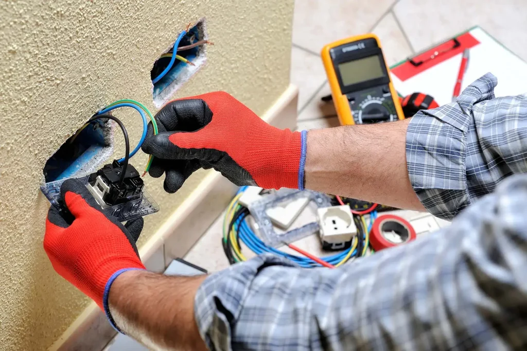 Technician fixing electric equipment
